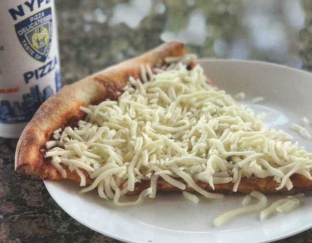 Image of NYPD Pizza's Oneonta Slice, a standard cheese pizza slice topped with cold, shredded cheese, on a table next to a soda.