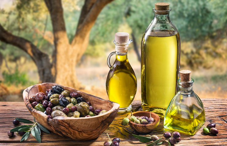A variety of olive oils and olives
