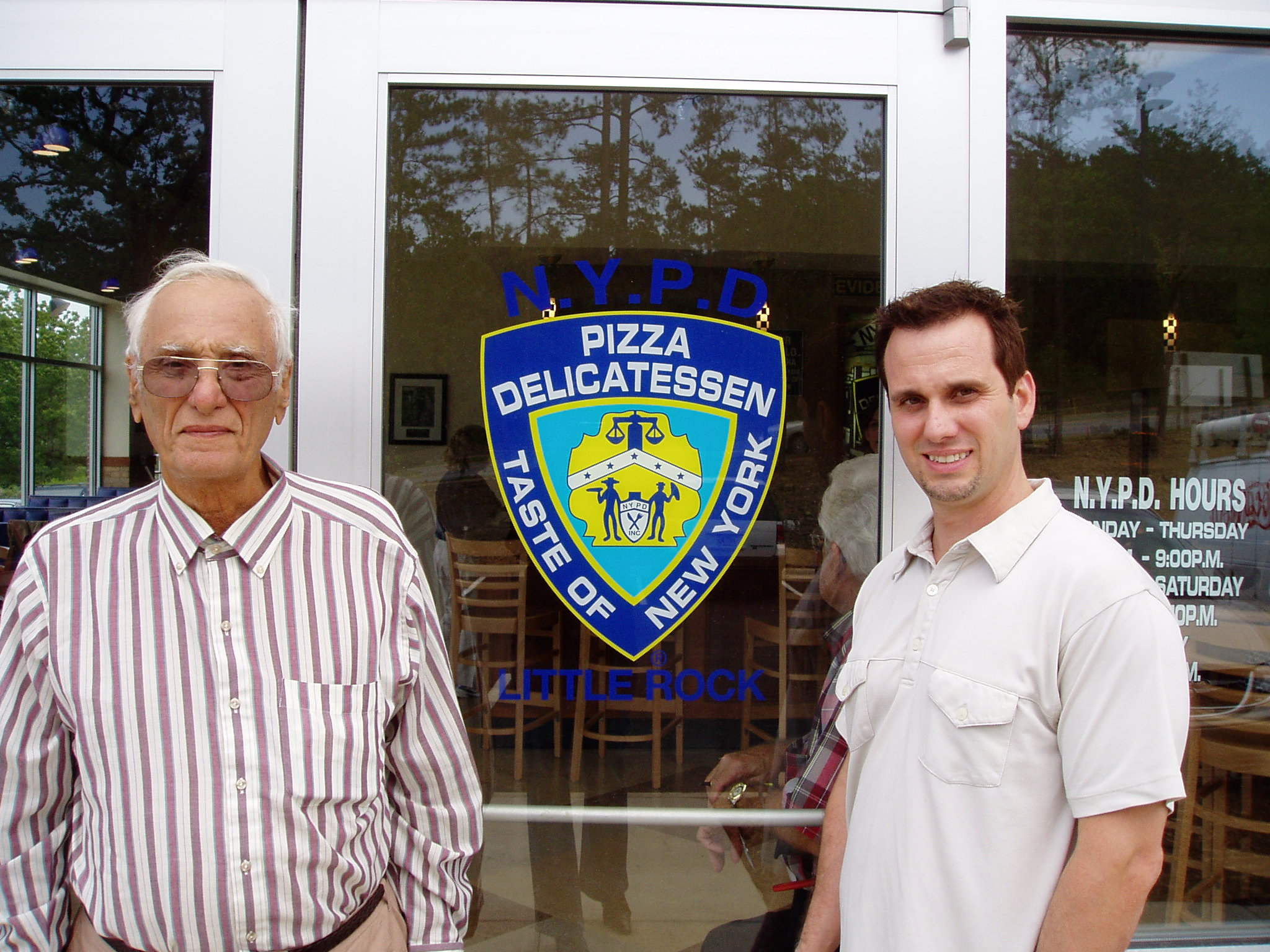 Image of NYPD Pizza founder and CEO Paul Russo and his father Mariano Russo outside of the NYPD Pizza Little Rock location